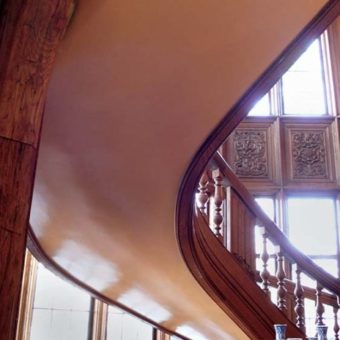 Christianson Lee Studios woodgrained mahogany and trompe l'oeil panels on Grand Staircase, before view