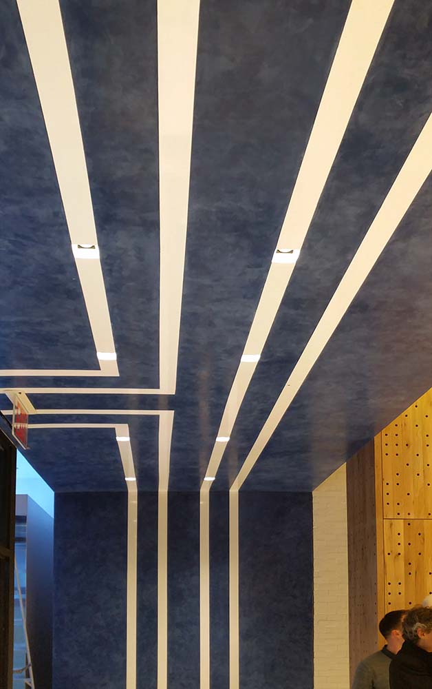 Venetian plaster walls and ceiling logo by Christianson Lee Studios for Tory Sport